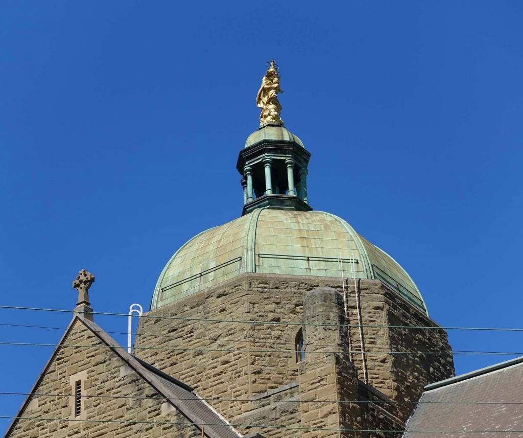Our Lady 01 statue on top of heritage building