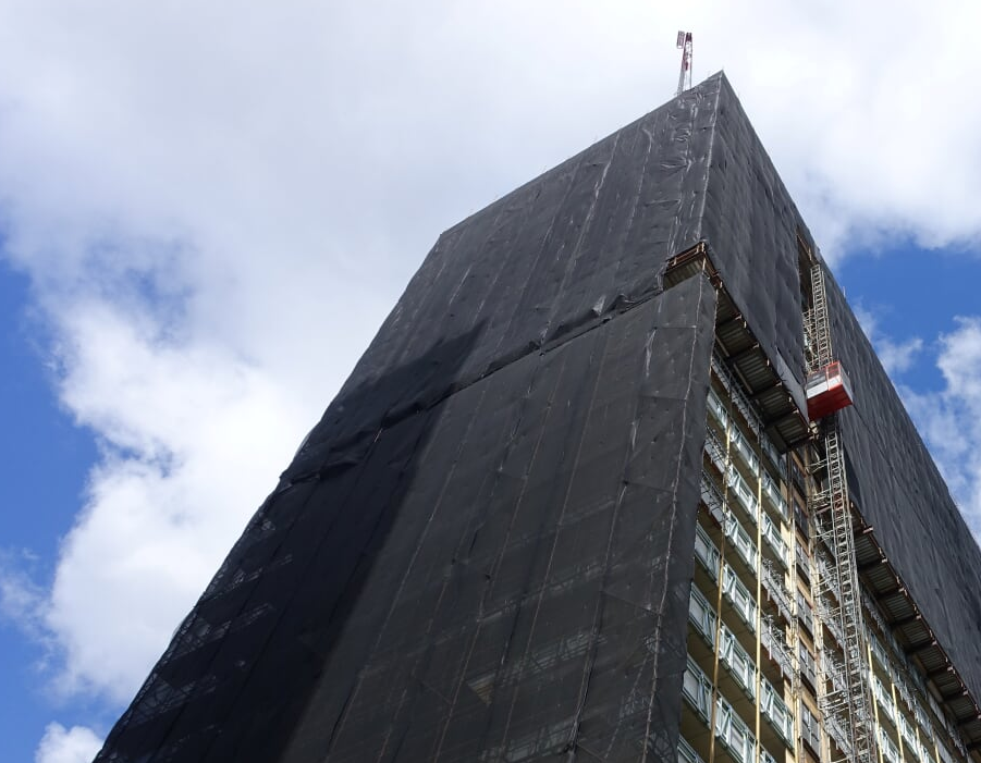 Suncorp 01 top floors of building covered in scaffold
