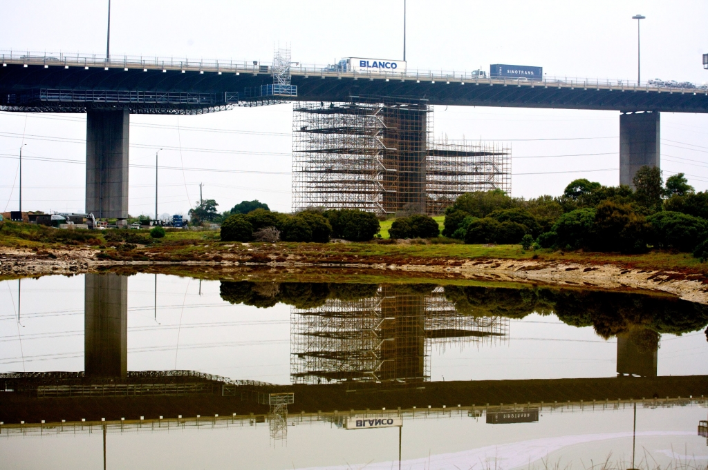Westgate Bridge trucks travelling over westgate bridge with scaffold underneath